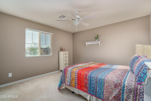 carpeted bedroom featuring baseboards, visible vents, and ceiling fan