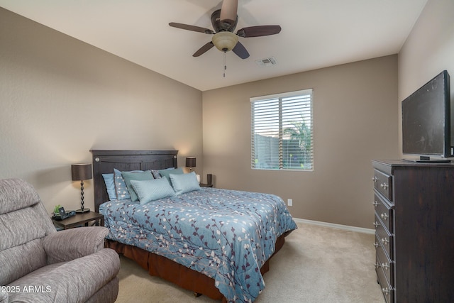 bedroom featuring a ceiling fan, visible vents, light carpet, and baseboards