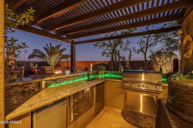 view of patio / terrace with an outdoor kitchen, a fenced backyard, grilling area, and a pergola