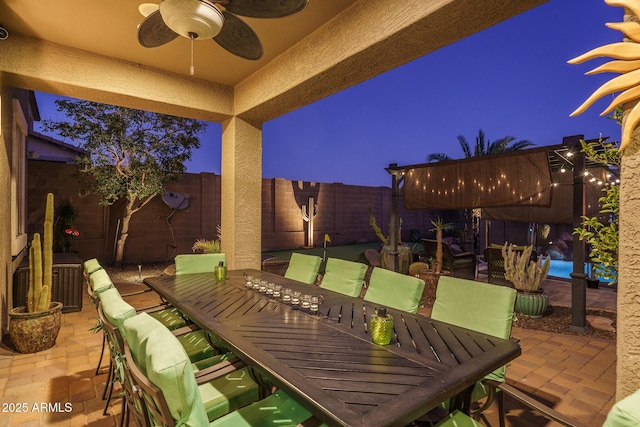 view of patio / terrace featuring outdoor dining space, a fenced backyard, and ceiling fan