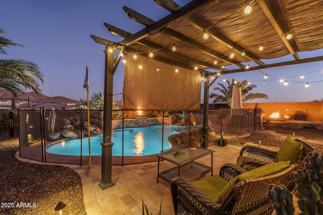 pool with a patio, fence, and a pergola