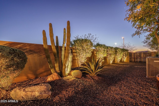 view of yard featuring a fenced backyard and cooling unit