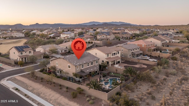 birds eye view of property with a residential view and a mountain view