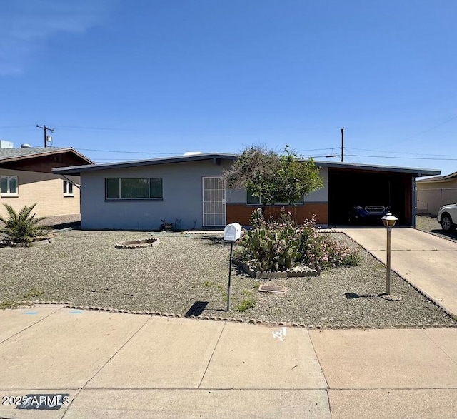 513 S Cardinal Dr, Apache Junction, AZ 85120 - single story home with driveway and an attached carport