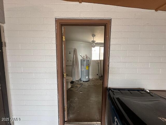513 S Cardinal Dr, Apache Junction, AZ 85120 - entrance to property featuring electric water heater and concrete block siding