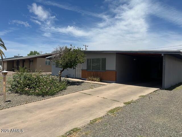 513 S Cardinal Dr, Apache Junction, AZ 85120 - ranch-style home with concrete driveway and a carport