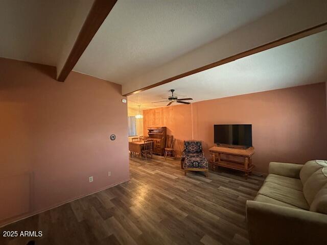 513 S Cardinal Dr, Apache Junction, AZ 85120 - living area with beam ceiling, wood finished floors, and ceiling fan