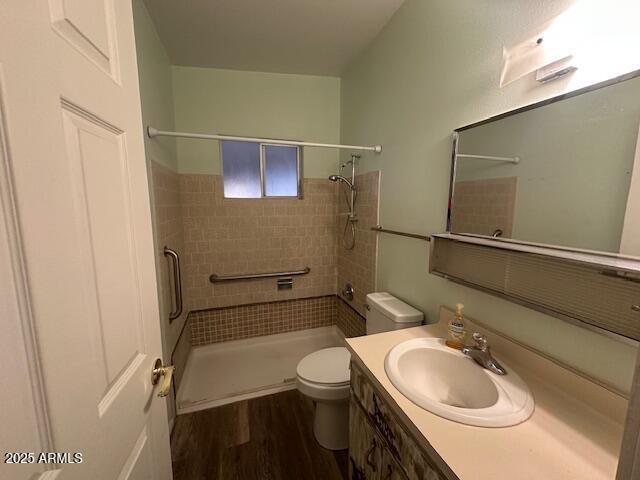 513 S Cardinal Dr, Apache Junction, AZ 85120 - full bath featuring toilet, a shower stall, vanity, and wood finished floors