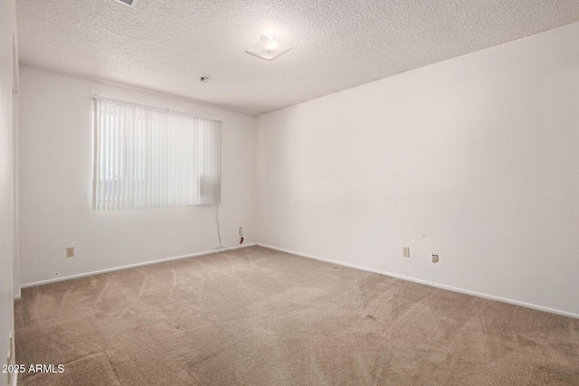 7849 E Golf Ave, Mesa, AZ 85209 - empty room with carpet floors, a textured ceiling, and baseboards