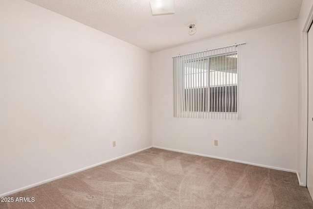 7849 E Golf Ave, Mesa, AZ 85209 - carpeted empty room with baseboards and a textured ceiling