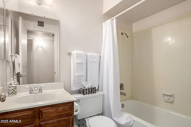 7849 E Golf Ave, Mesa, AZ 85209 - bathroom with shower / bath combo with shower curtain, vanity, and toilet