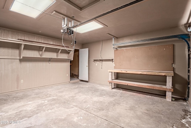 7849 E Golf Ave, Mesa, AZ 85209 - garage featuring a workshop area and a garage door opener