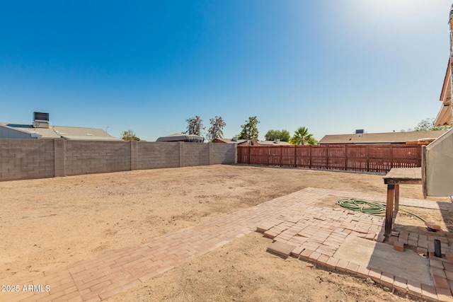 7849 E Golf Ave, Mesa, AZ 85209 - fenced backyard featuring a patio