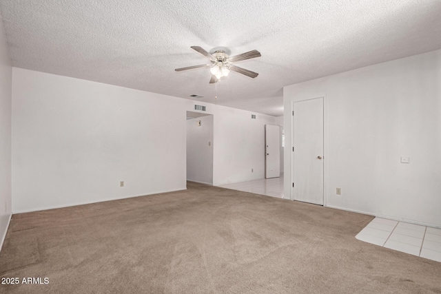 7849 E Golf Ave, Mesa, AZ 85209 - carpeted spare room featuring a ceiling fan, a textured ceiling, and tile patterned flooring