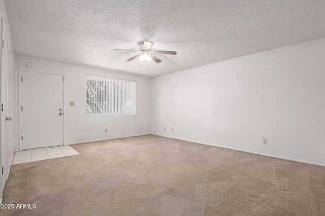 7849 E Golf Ave, Mesa, AZ 85209 - unfurnished room with carpet floors, a ceiling fan, a textured ceiling, and baseboards