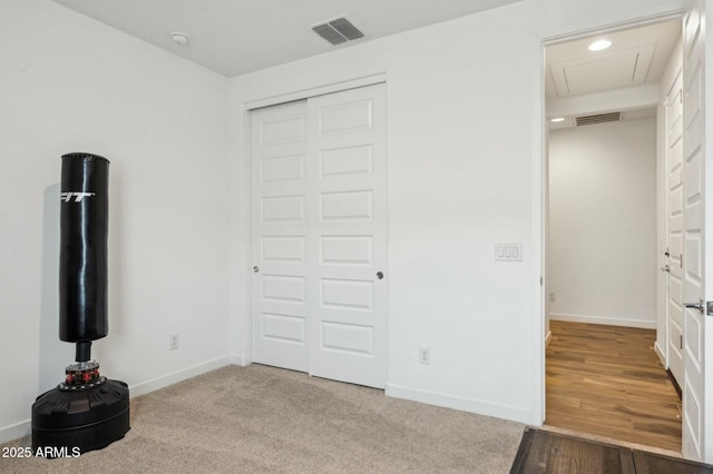 unfurnished bedroom featuring baseboards, visible vents, and a closet