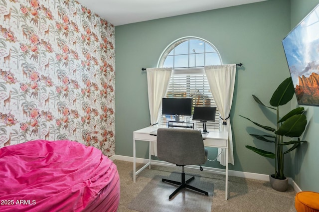 carpeted office featuring baseboards