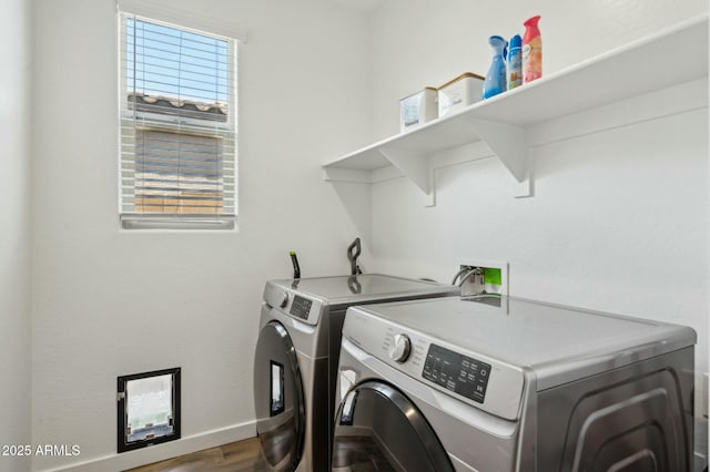 laundry area featuring separate washer and dryer, baseboards, a healthy amount of sunlight, and laundry area