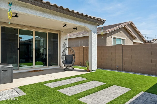 view of yard featuring fence and a patio