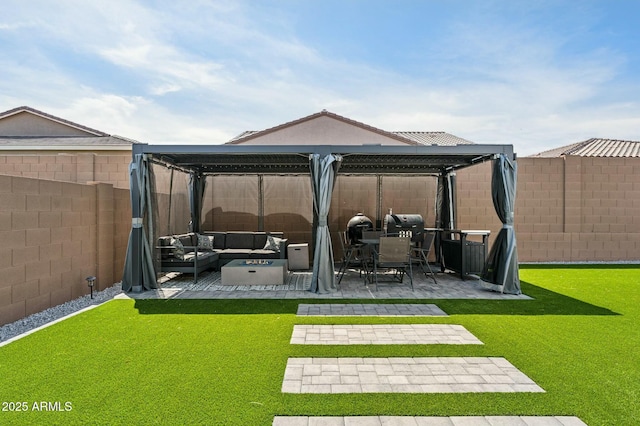 view of yard with outdoor lounge area, a fenced backyard, and a patio