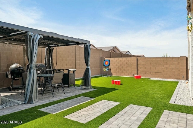view of yard with a fenced backyard and a patio