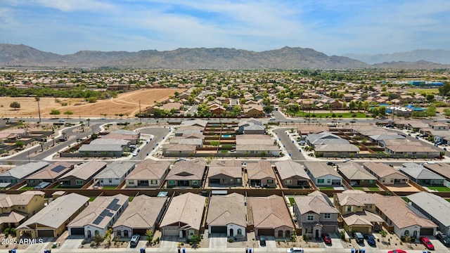 drone / aerial view featuring a residential view and a mountain view