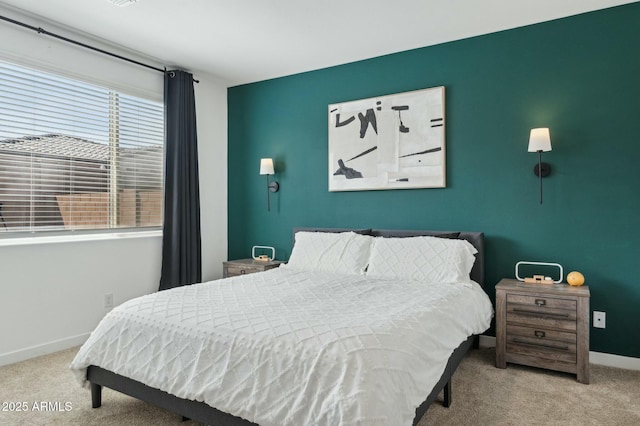 bedroom with baseboards and carpet flooring