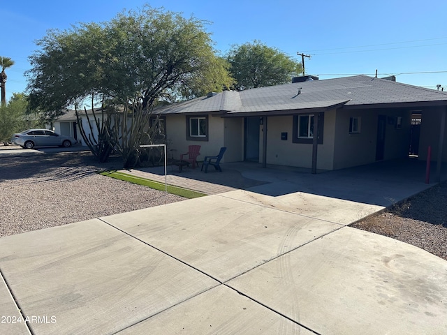 ranch-style home with a carport