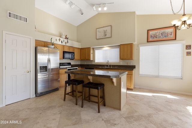 kitchen with a center island, hanging light fixtures, stainless steel fridge with ice dispenser, high vaulted ceiling, and a kitchen bar