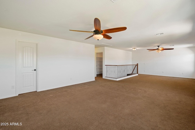 12217 W Planada Ln, Sun City, AZ 85373 - spare room featuring baseboards, visible vents, ceiling fan, and carpet flooring