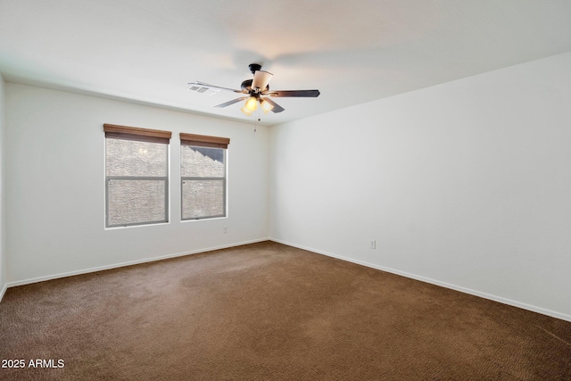 12217 W Planada Ln, Sun City, AZ 85373 - empty room featuring baseboards, dark colored carpet, visible vents, and ceiling fan