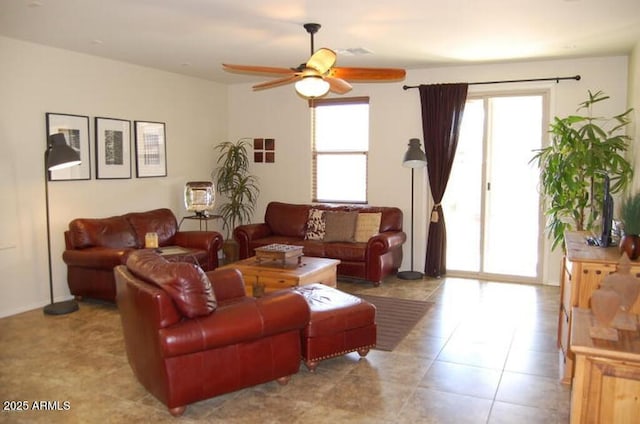 12217 W Planada Ln, Sun City, AZ 85373 - living room featuring a ceiling fan and a wealth of natural light