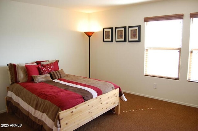 12217 W Planada Ln, Sun City, AZ 85373 - bedroom featuring multiple windows, carpet, and baseboards