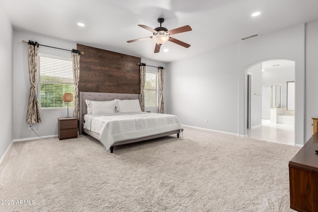 bedroom with arched walkways, carpet floors, recessed lighting, baseboards, and ceiling fan