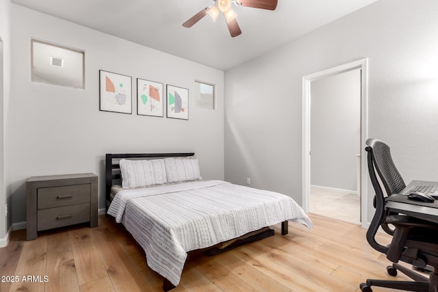 bedroom with wood-type flooring and ceiling fan