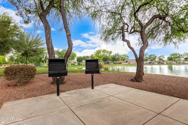 surrounding community with a water view