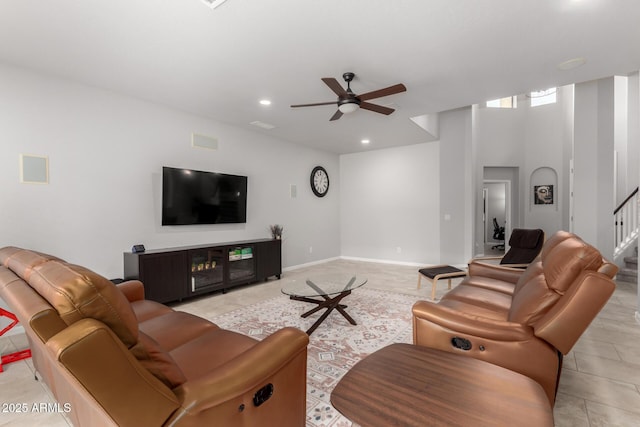 living room with ceiling fan, stairway, and recessed lighting