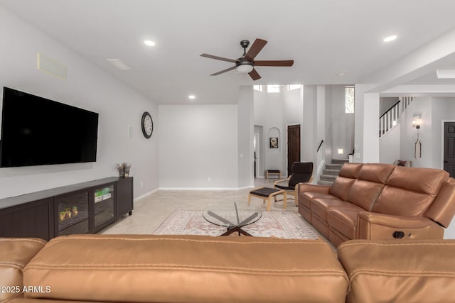 living area featuring ceiling fan, recessed lighting, stairs, and baseboards