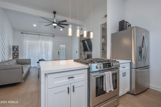 kitchen featuring light wood-type flooring, appliances with stainless steel finishes, and white cabinets