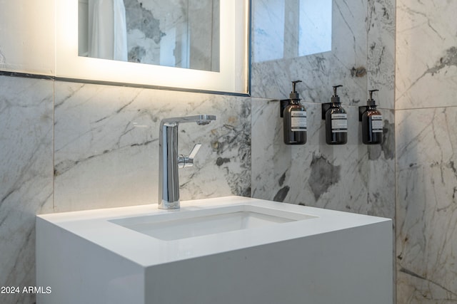 bathroom featuring tile walls and vanity