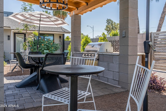 view of patio featuring grilling area and an outdoor kitchen