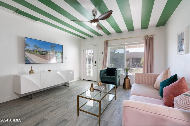 living room with ceiling fan and wood-type flooring