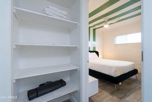 bedroom with hardwood / wood-style flooring and ceiling fan