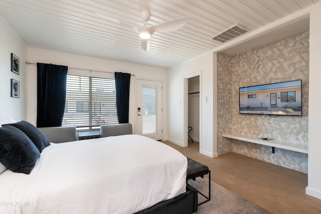 bedroom featuring a closet, ceiling fan, light colored carpet, and wooden ceiling