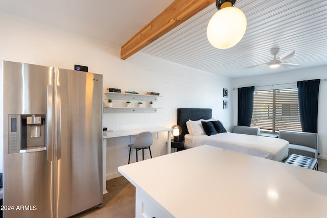 kitchen featuring light carpet, ceiling fan, stainless steel refrigerator with ice dispenser, beam ceiling, and white cabinets