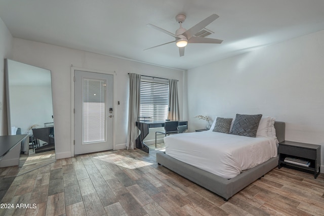 bedroom with ceiling fan and hardwood / wood-style floors