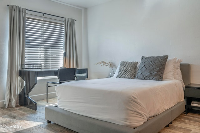 bedroom with light wood-type flooring