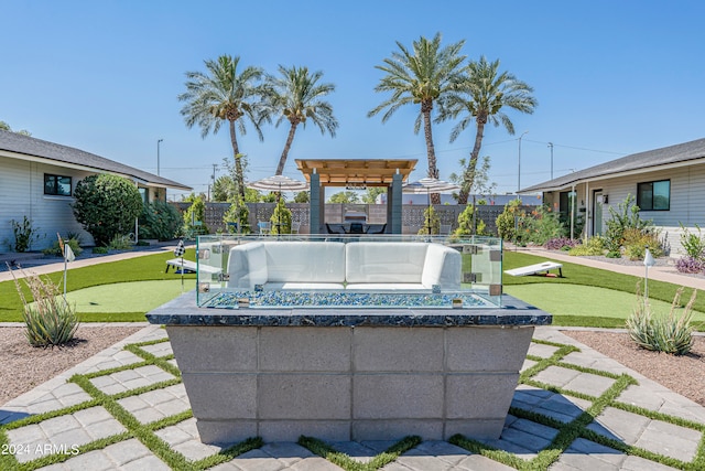 view of patio with a pergola and a hot tub