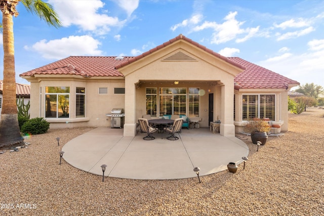 back of property with a patio area