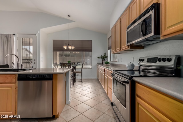 kitchen with vaulted ceiling, sink, stainless steel appliances, light tile patterned floors, and a chandelier